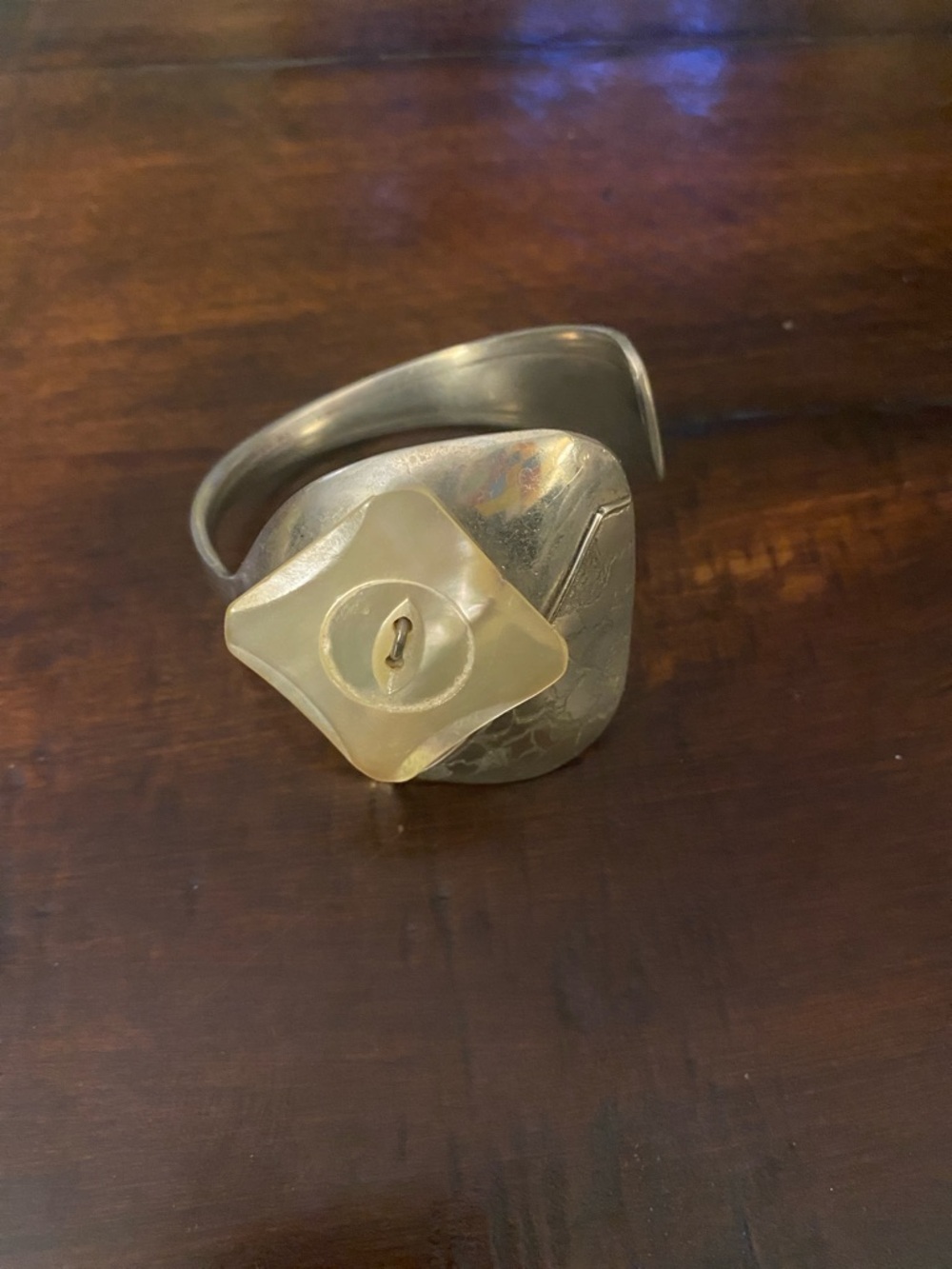Handcrafted Silver Tone Cuff Bracelet with Cream Button Accent